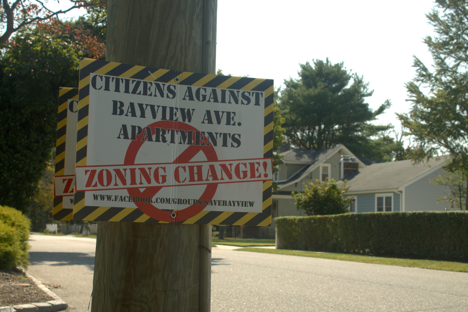 A sign located on Bayview Avenue in East Islip. A proposal currently under review by the Town of Islip Planning Board would rezone the property at 9 Bayview Avenue to permit 16 cottage-style senior housing units around the home.